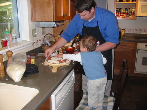 Seth helping make pizza